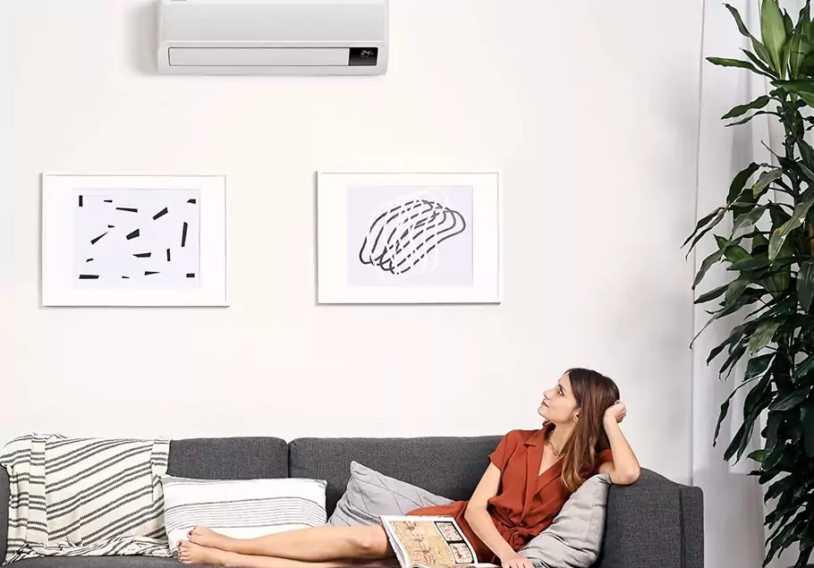 The image shows the Samsung Wind-Free Elite Split air conditioner in white.