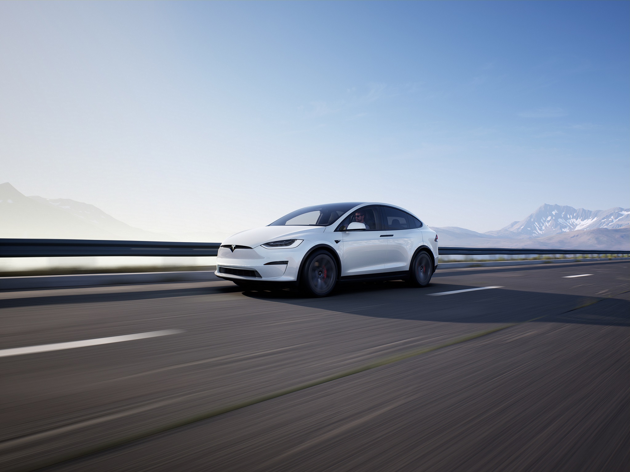 Na obrazku znajduje się auto elektryczne Tesla model X w kolorze białym.